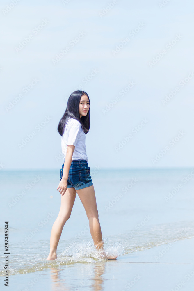 asian teenager relaxing with happiness on vacation sea beach asian teenager relaxing with happiness on vacation sea beach
