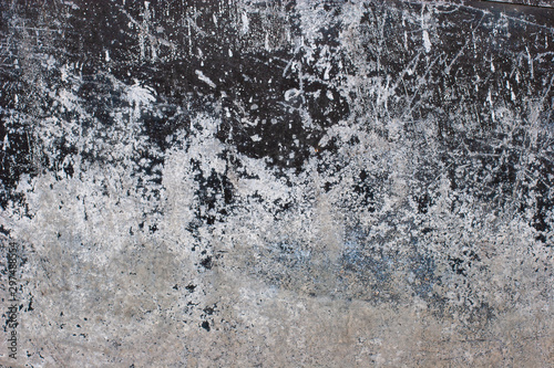 Abstract grunge background. Old rusty metal with corrosion, scratches and scuffs. The paint color is black and white.
