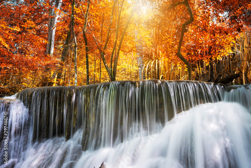 Amazing in nature, beautiful waterfall at colorful autumn forest in fall season