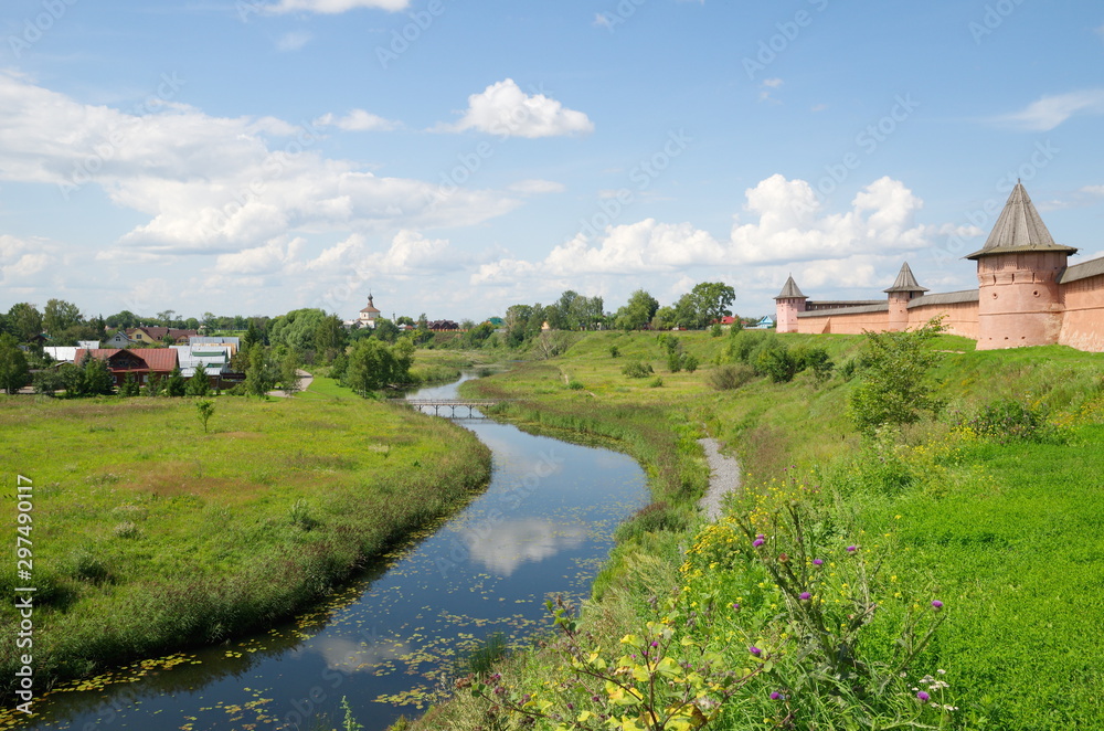 Summer landscape with a view of the Kamenka river and the Spaso-Evfimiev monastery. The city of Suzdal. The Golden ring of Russia