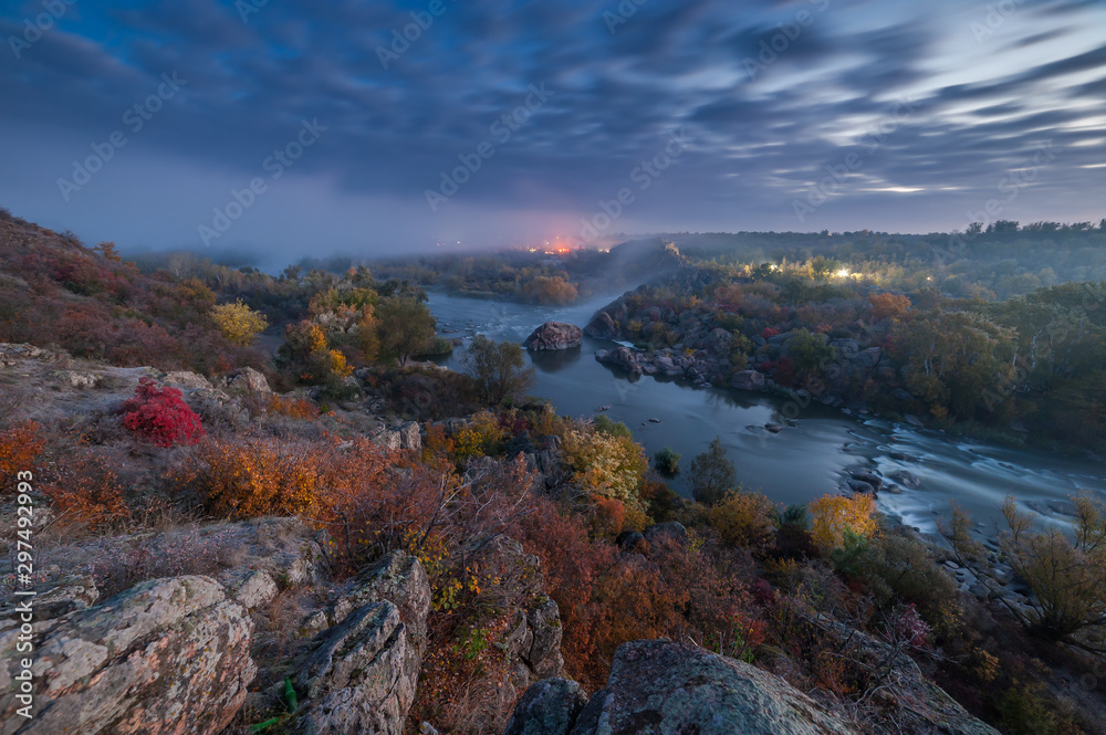Fall landscape with river on sunrise