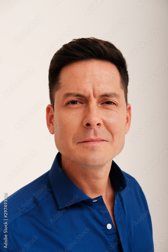 Studio portrait of handsome man in blue shirt Studio portrait of handsome man in blue shirt
