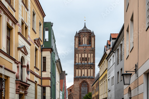 Traditional colorful houses and church tower in the old town of Stralsund © jjfarq