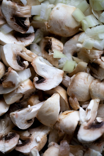 сooking onions and mushrooms on wok pan