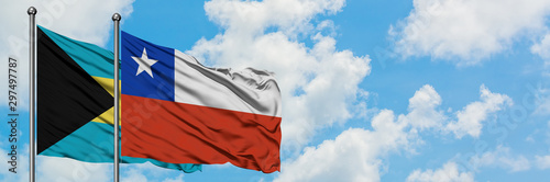 Free Download Bahamas and Chile flag waving in the wind against white cloudy blue sky together. Diplomacy concept, international relations. - GFXLoad
