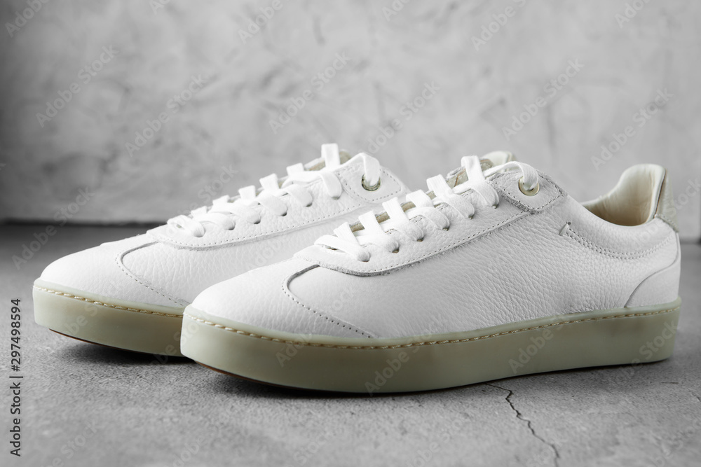 White plimsolls made of tumbled leather, matching laces, fabric lining and lightweight platform soles