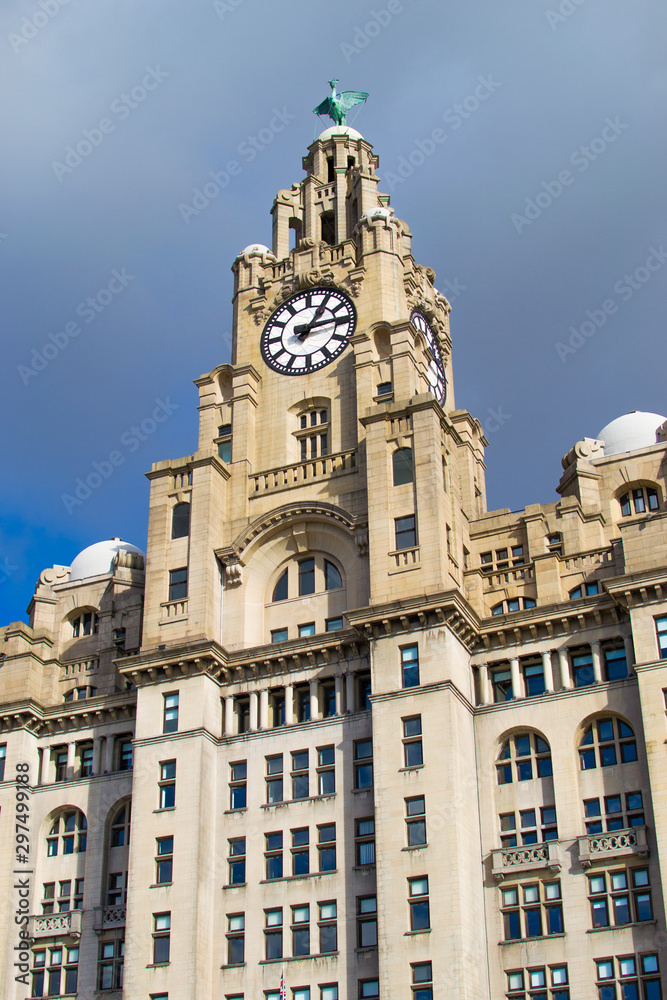 Tower of the Royal Liver Building with a white clock in Liverpool, England, United Kingdom