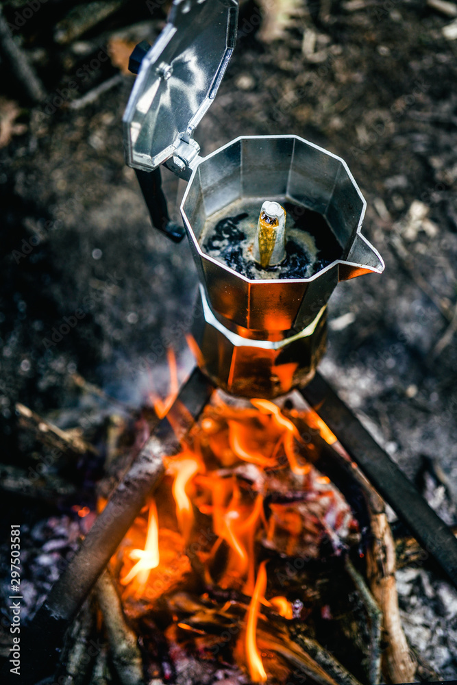 Steaming moka pot on campfire Stock Photo | Adobe Stock