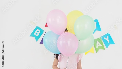 Happy little asian girl  with balloons in birthday party