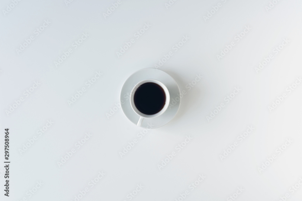 cup with black coffee on the white table. flat lay, top view. coffee art cup with black coffee on the white table. flat lay, top view. coffee art