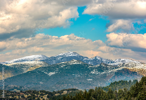  view of snow coated Helmos mountain which located in Peloponnese. Grecce.The photo taken from the opposite mountain named Mainalo photo