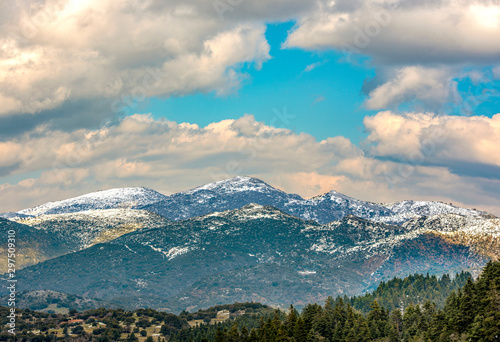  view of snow coated Helmos mountain which located in Peloponnese. Grecce.The photo taken from the opposite mountain named Mainalo