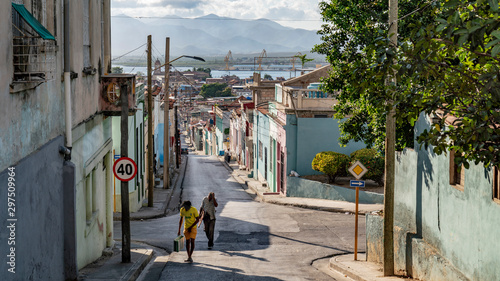 san francisco street with people and a street sign in santiago de cuba