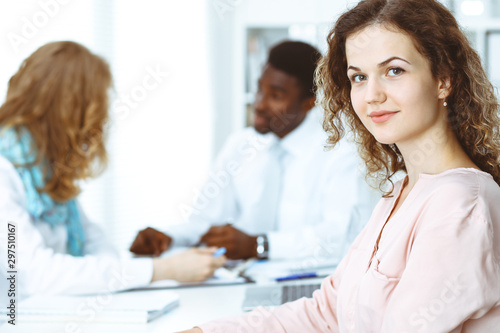 Business woman at meeting in office, colored in white. Multi ethnic business people group