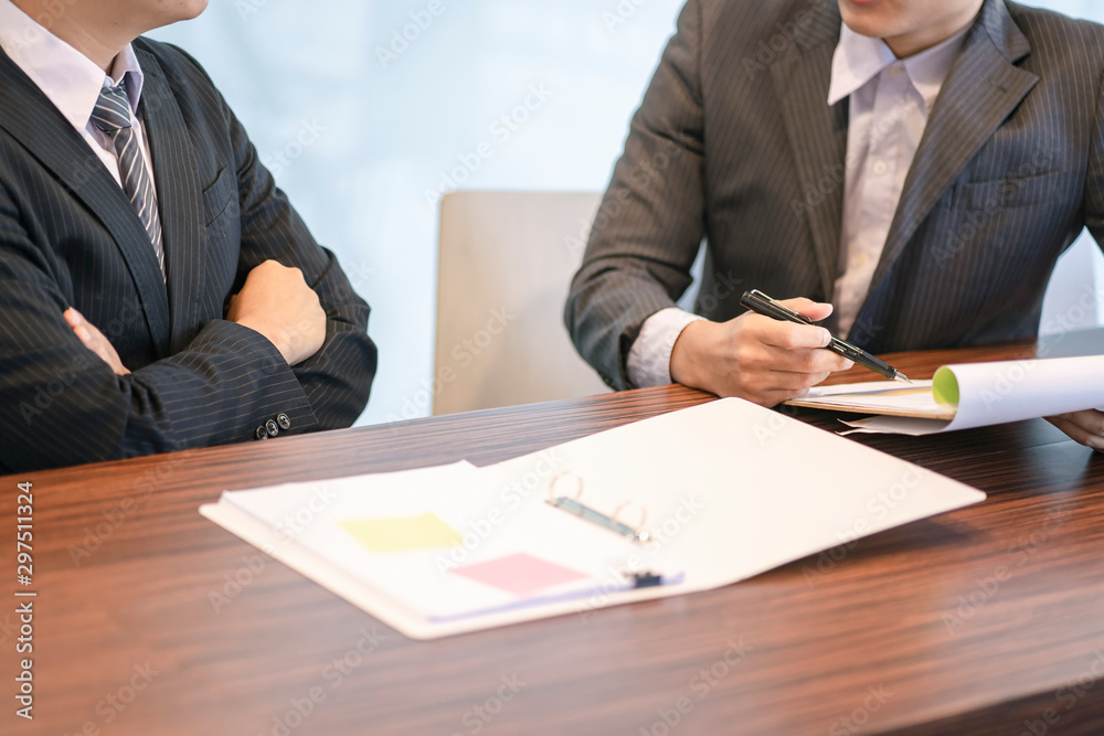 Close up of Businessmen discuss information or brainstorm metting in a business working space.