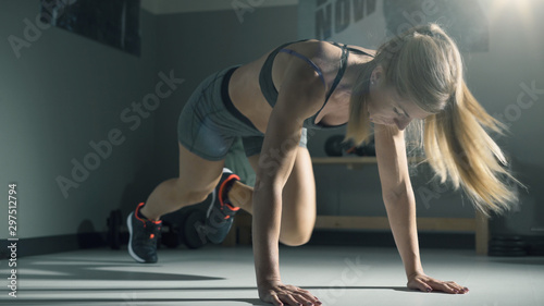 Woman exercising and running in place at the gym
