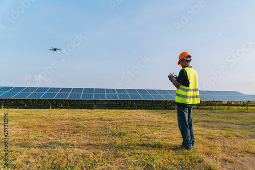 Inspector engineering concept  Engineer inspect and checking solar panel by Drone at solar power plant © only_kim