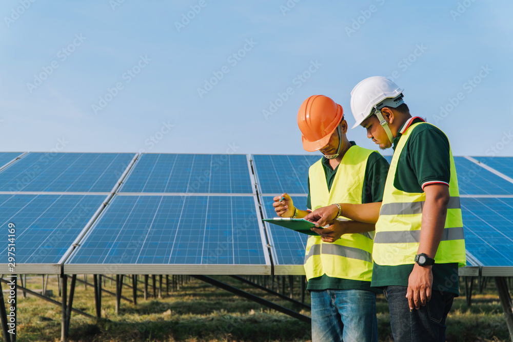 Inspector engineering concept; Engineer inspect solar panel at solar power plant Inspector engineering concept; Engineer inspect solar panel at solar power plant