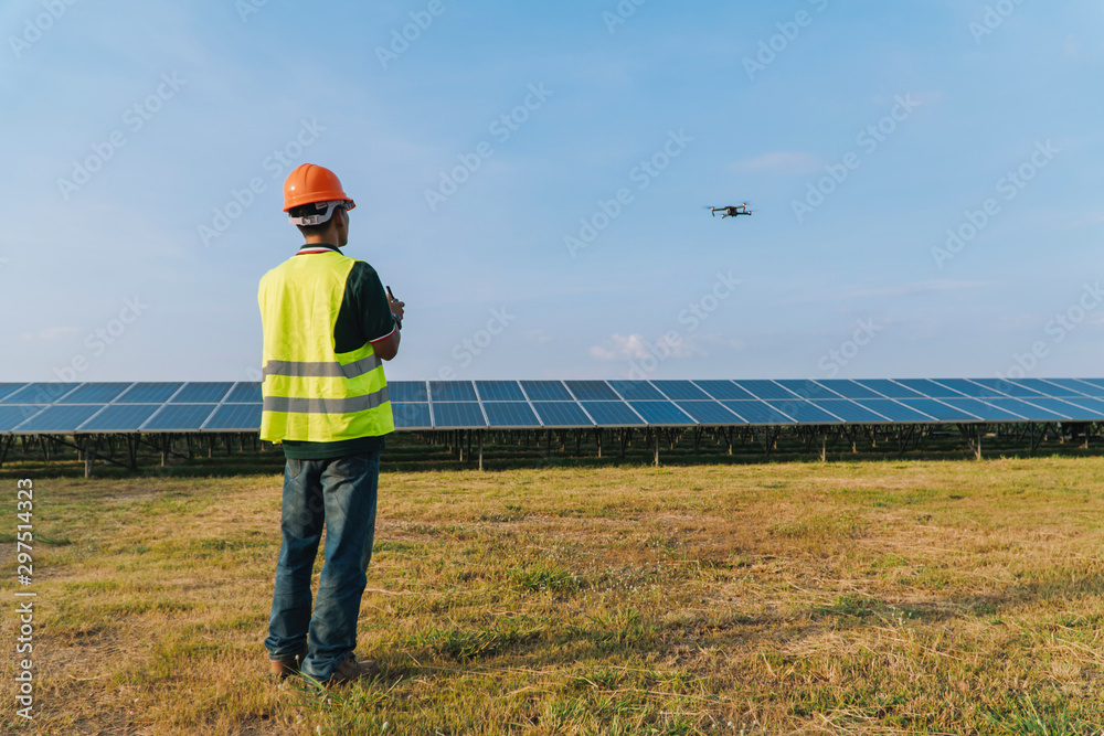 custom made wallpaper toronto digitalInspector engineering concept; Engineer inspect and checking solar panel by Drone at solar power plant
