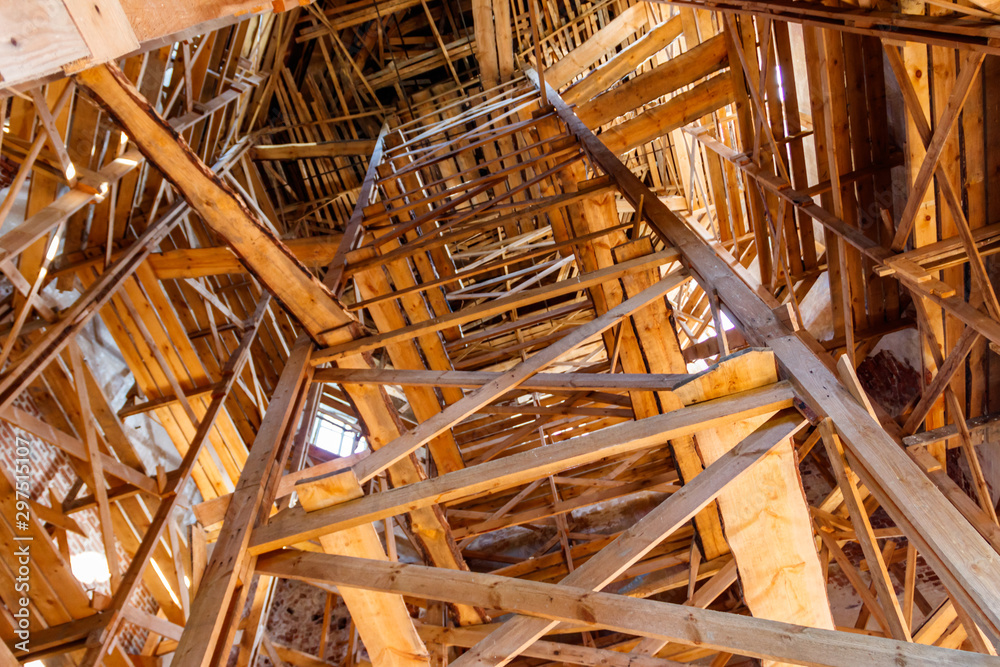 Wooden scaffolding inside building during renovation works. Looking up Wooden scaffolding inside building during renovation works. Looking up