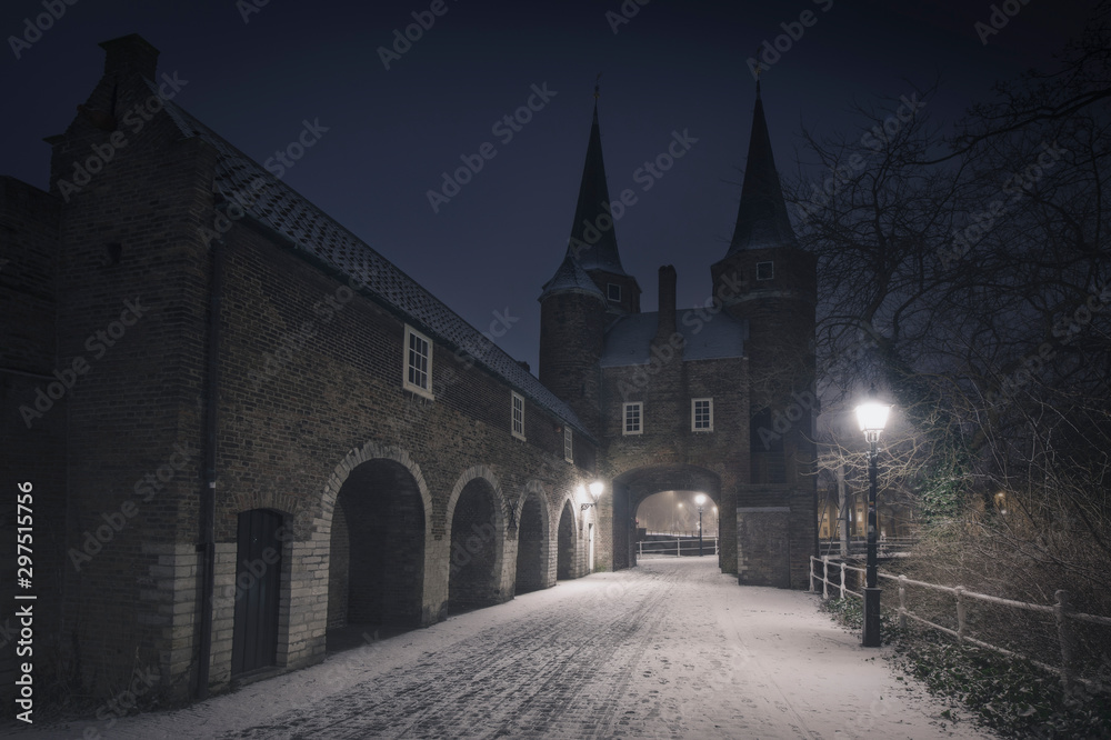 Night, dark blue after a snowfall in the typical Dutch city. Delft, Holland