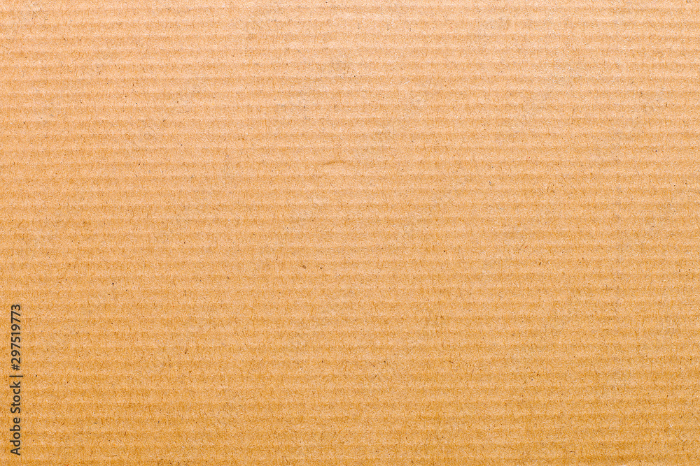 Top view closeup sheet of striped whole brown cardboard. Modern trendy abstract texture background Top view closeup sheet of striped whole brown cardboard. Modern trendy abstract texture background