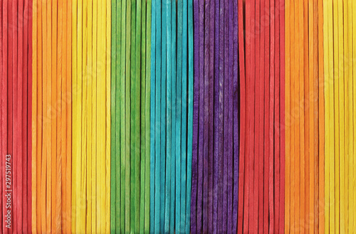 Colorful wooden wall texture background in bright rainbow colors pattern.