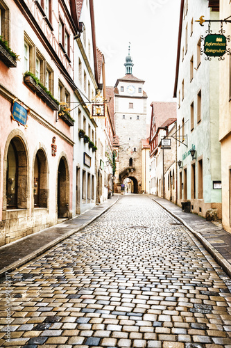 ROTHENBURG OB DER TAUBER  GERMANY - MARCH 05  Typical street on March 05  2016 in Rothenburg ob der Tauber  Germany. It is well known for its well-preserved medieval old town.