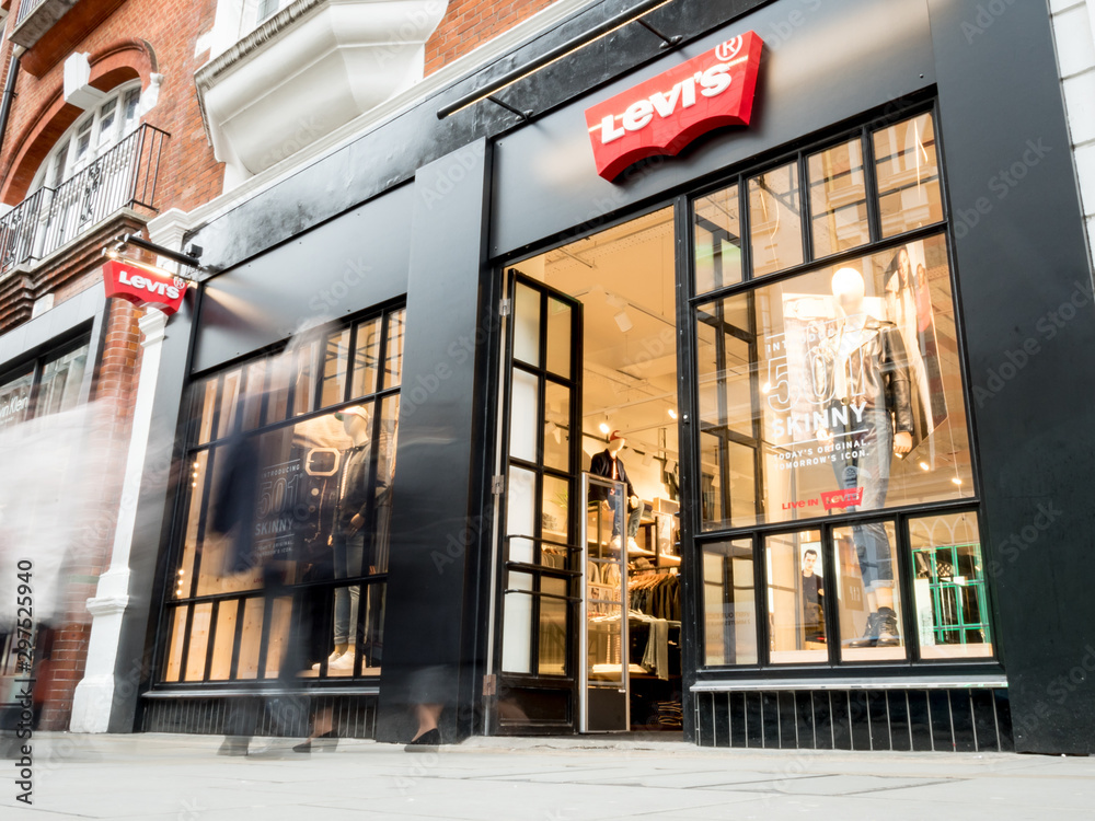Levis store, Covent Garden, London. Long exposure, blurred shoppers walking  by the shop front to the high street fashion store, Levi's. Stock Photo |  Adobe Stock