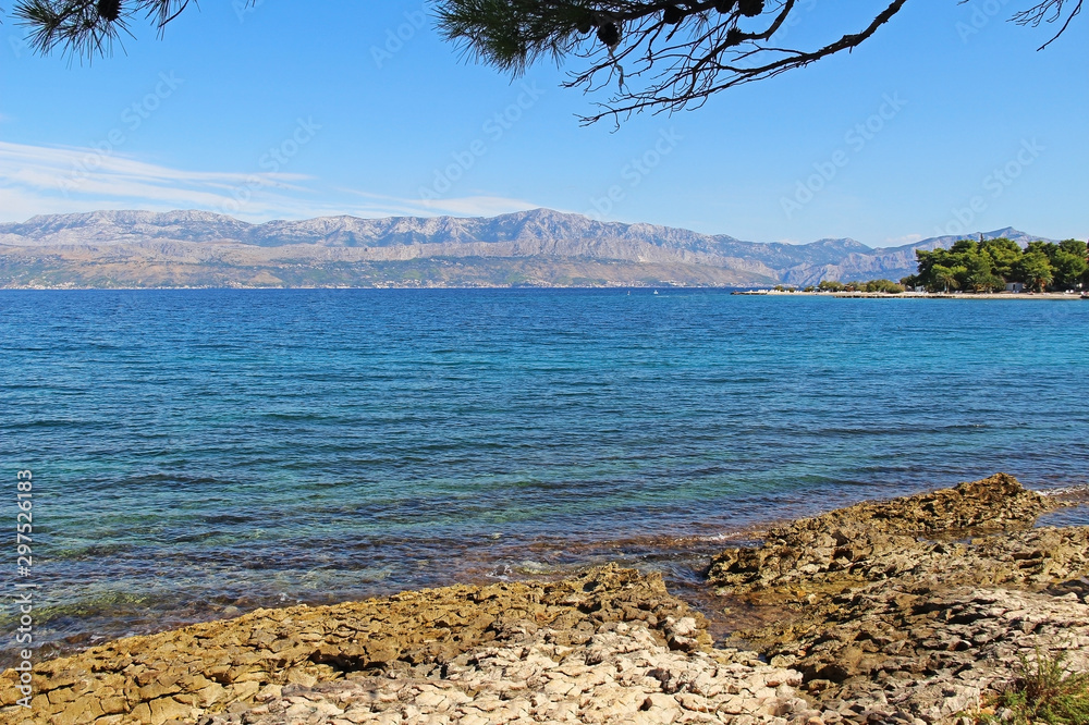 Beautiful landscape of sea Coast of Adriatic sea with Transparent Blue Water near Supetar, Croatia. Popular travel destinations.