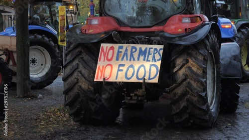 Tractors with flashing lights causing public disorder and traffic jams during the farmers protests in Holland. A sign on vehicle stating No farmers, No food. photo