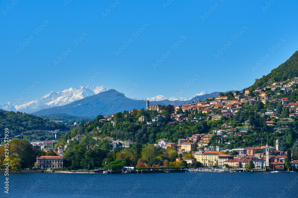 Alps in the snow Lake Como Italy. Clear blue sky Top view of the city of Como
