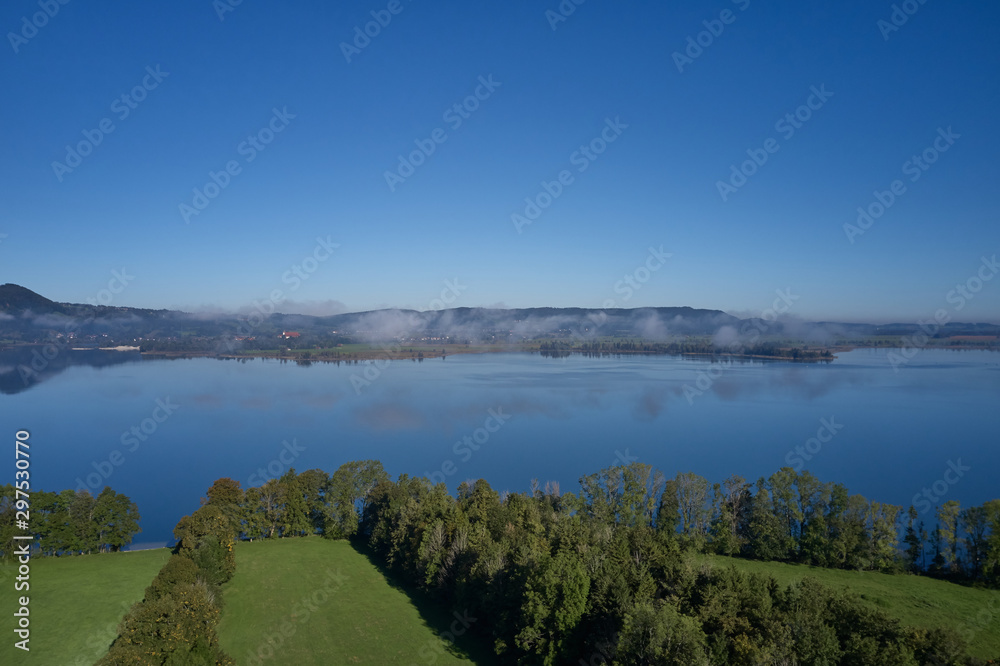 Beautiful panorama of lake Kochelsee, Bavaria Germany. Flying on drone.