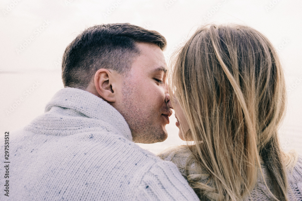 couple hugging on a pier couple hugging on a pier