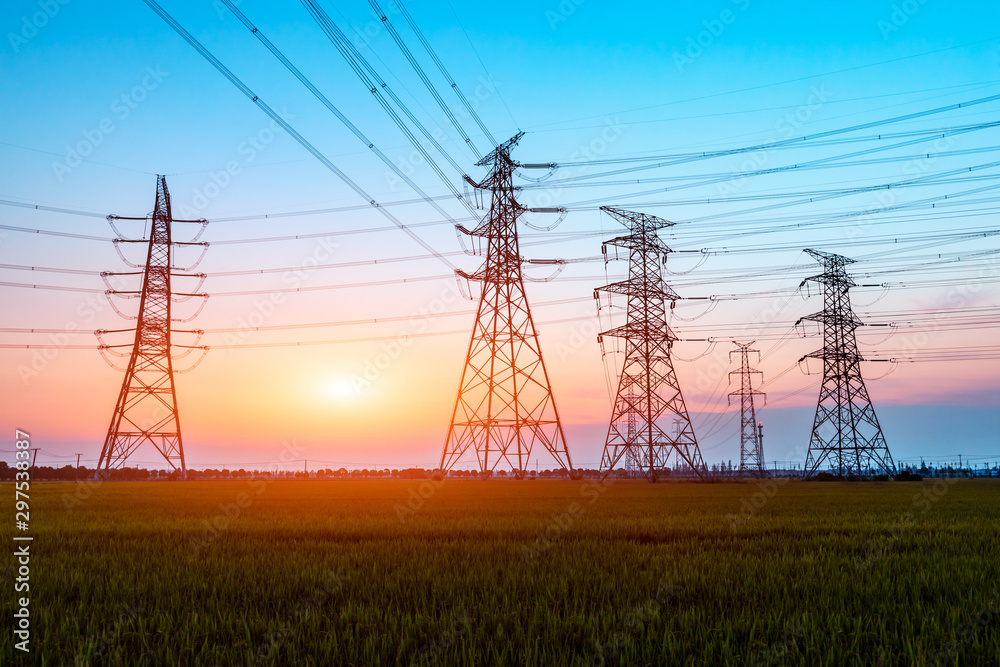 Fototapeta premium Electricity tower silhouette and sky landscape at dusk