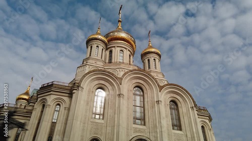 Hyperlapse temple of New Martyrs and Confessors golden domes cross Lubyanka Moscow architecture Russia Orthodox Church Monastery modern sight. Faith culture historical. Sunny blue sky clouds. Forward