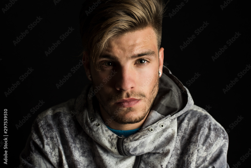 portrait of young boy, studio photo, looking at the camera with a serious attitude