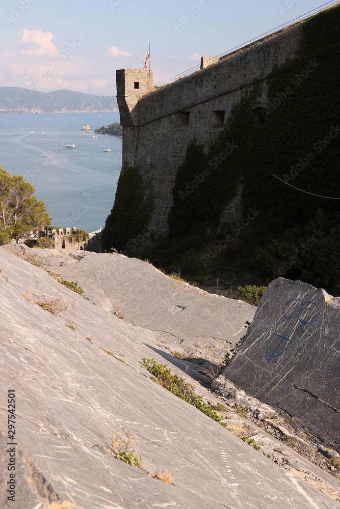 Walls of the castle of Portovenere with turret and the background of the sea. Walls of the castle of Portovenere with turret and the background of the sea.