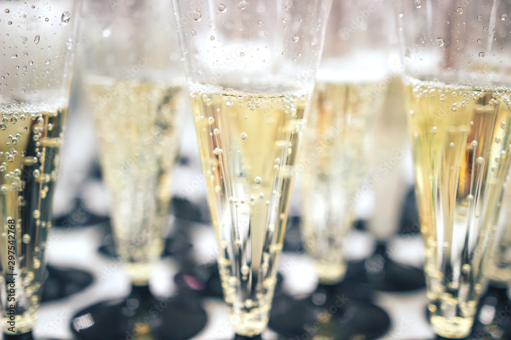 Many glasses with champagne during on the party table Many glasses with champagne during on the party table