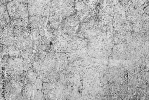 Texture of a concrete wall with cracks and scratches which can be used as a background