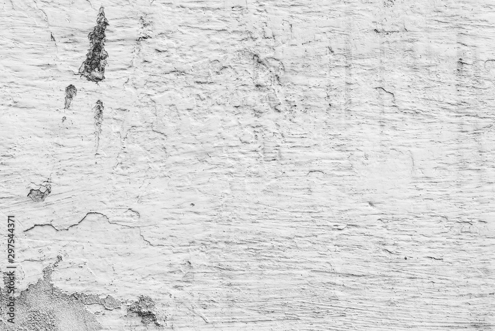 Fototapeta premium Texture of a concrete wall with cracks and scratches which can be used as a background