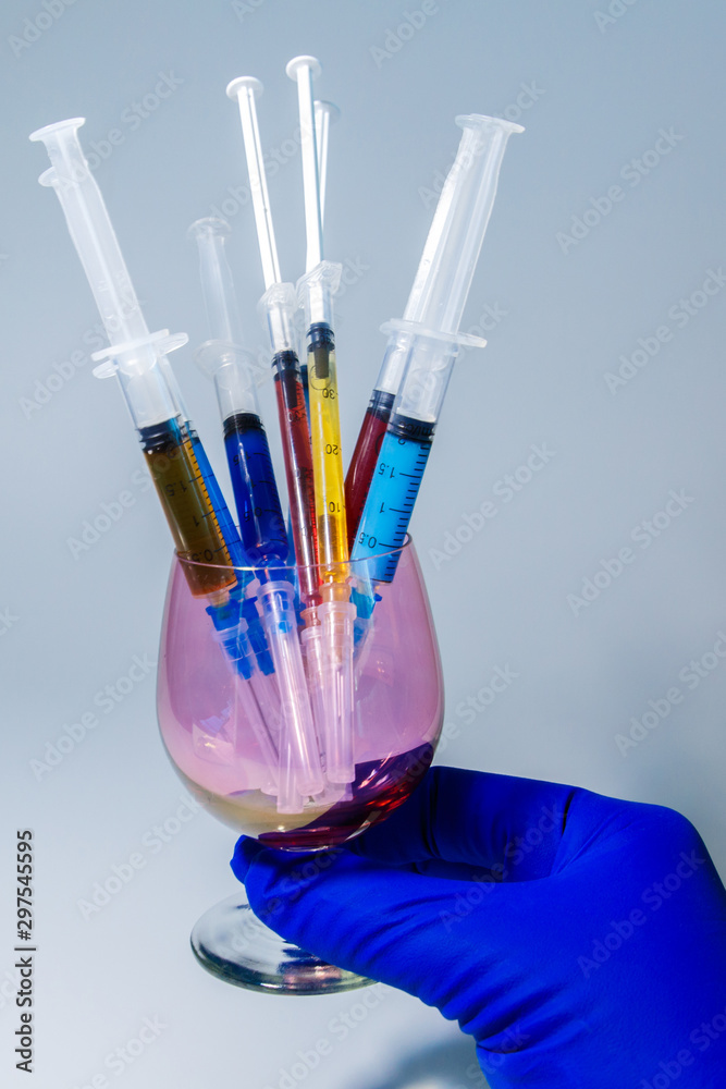 A set of medical syringes with color injections for cosmetology. The cocktail of the beautician for skin rejuvenation. A set of medical syringes with color injections for cosmetology. The cocktail of the beautician for skin rejuvenation.