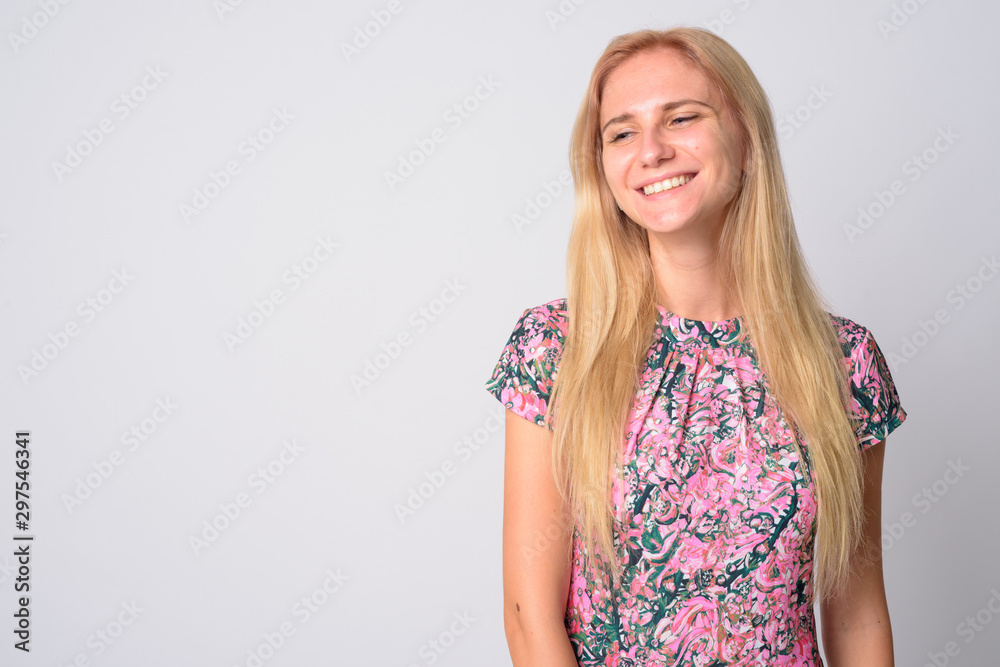 Face of happy young beautiful blonde woman smiling and looking down Face of happy young beautiful blonde woman smiling and looking down