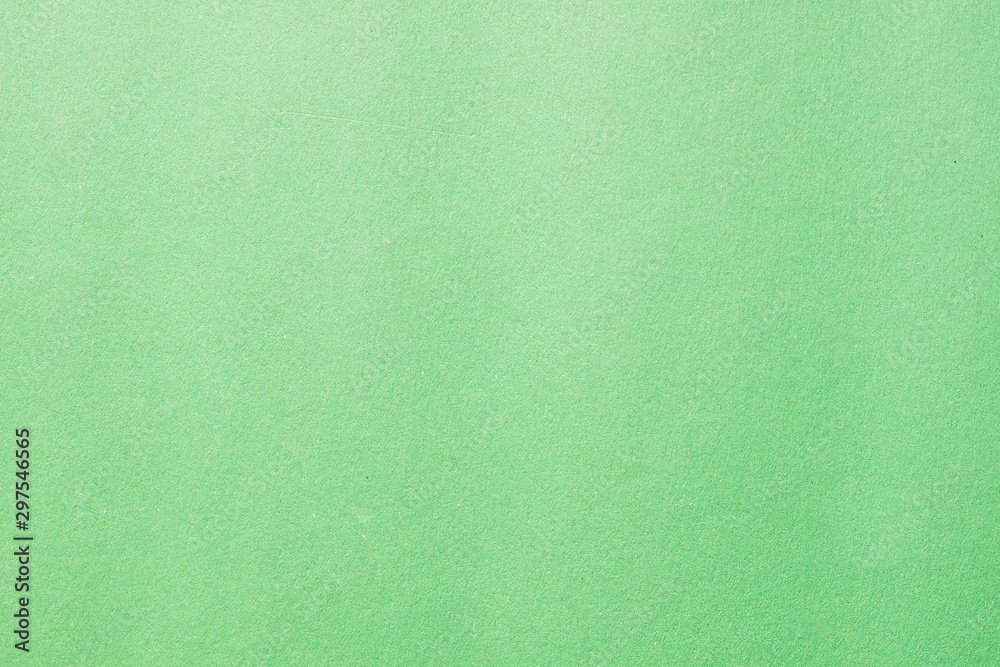 Green color cardboard. Clean light green paper texture. High resolution photo. Green color cardboard. Clean light green paper texture. High resolution photo.