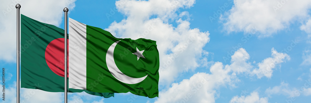 Obraz premium Bangladesh and Pakistan flag waving in the wind against white cloudy blue sky together. Diplomacy concept, international relations.