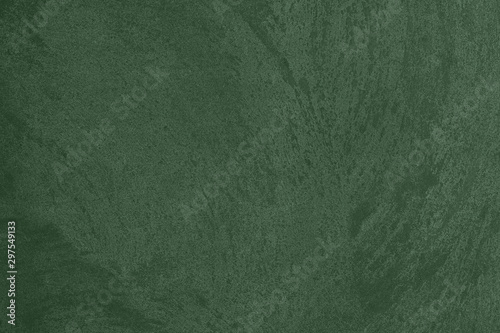 Dark green Concrete textured background to your concept or product. Winter 2020 color trend.