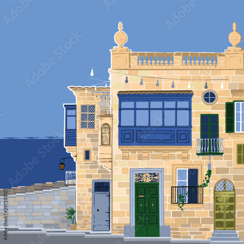 Traditional maltese Valletta houses made of sandy stone with a sea on the background.