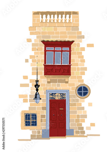 Part of traditional maltese house made of sandy stone bricks with red doors and balcony.