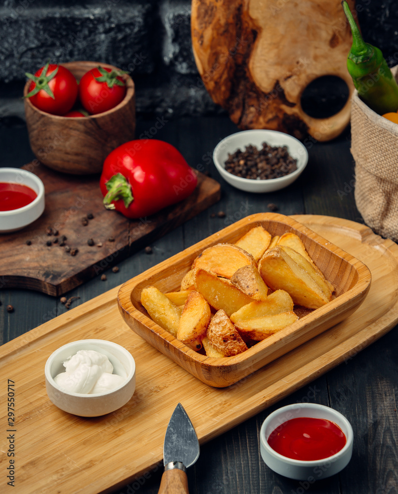 fried potatoes with mayonnaise and ketchup
