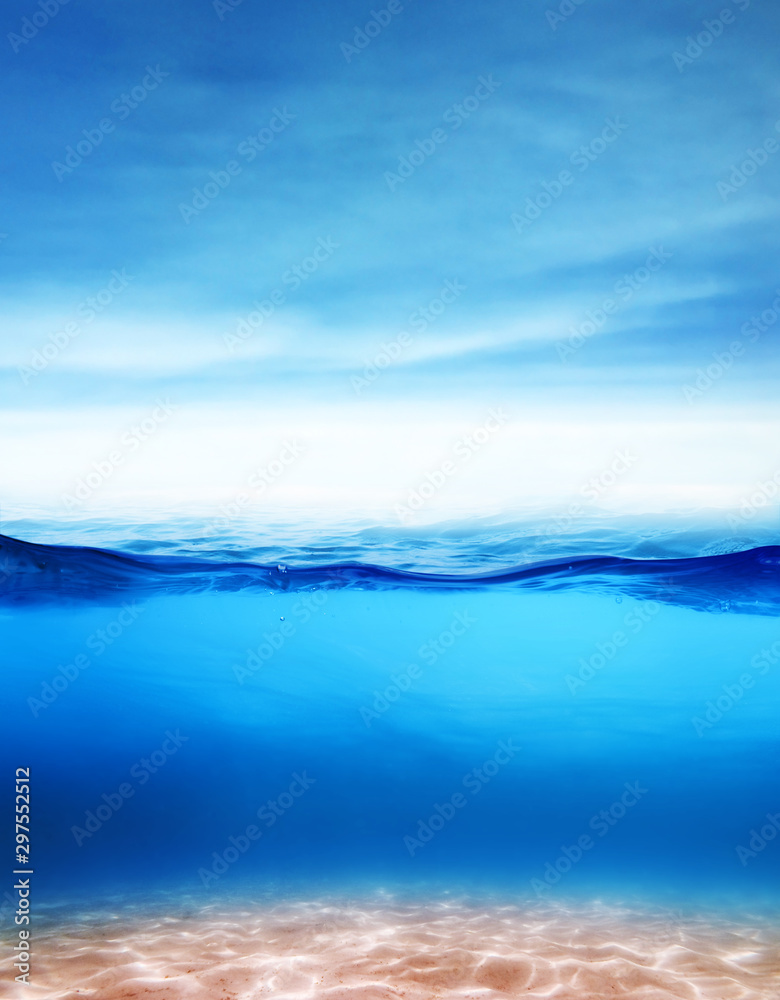 Beautiful underwater sea sandy scene view and ripples on water surface with  blue sky and clouds background